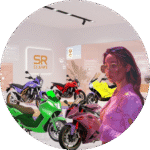 SR Claims agent and customer selecting like-for-like replacement motorcycles in a modern showroom.